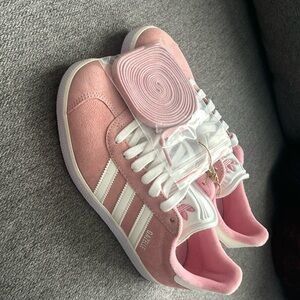Pink adidas Gazelle shoes